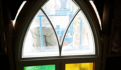 inside view of restored church window during installation process