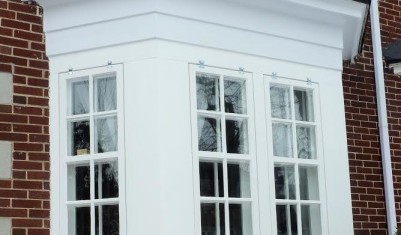 Bay window restoration with new storm sashes