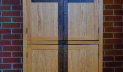 Storage cabinet for Catholic Church, Cherry with two-tone stain and cross detail