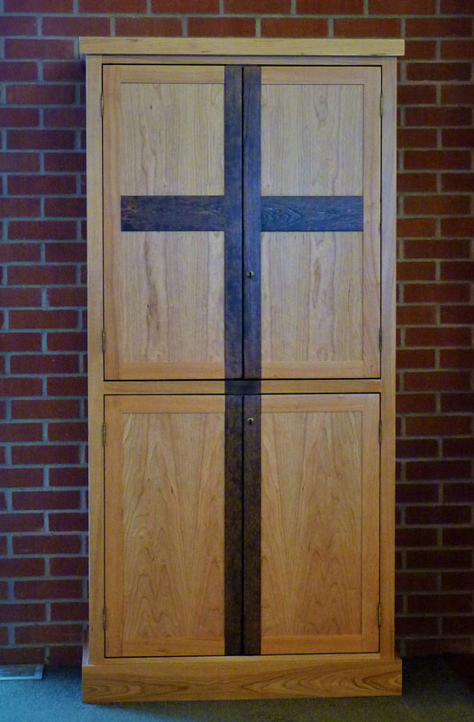 Storage cabinet for Catholic Church, Cherry with two-tone stain and cross detail