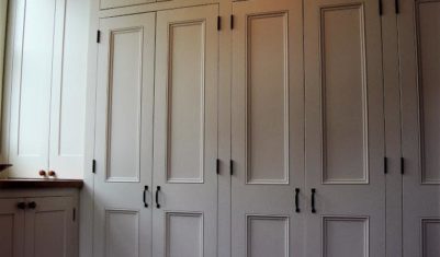 Built-in wall of closets for mudroom