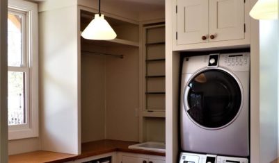 Mudroom detail: Pull-out recycling drawer, pull-down drying rack, sink, hanging space, laundry basket storage